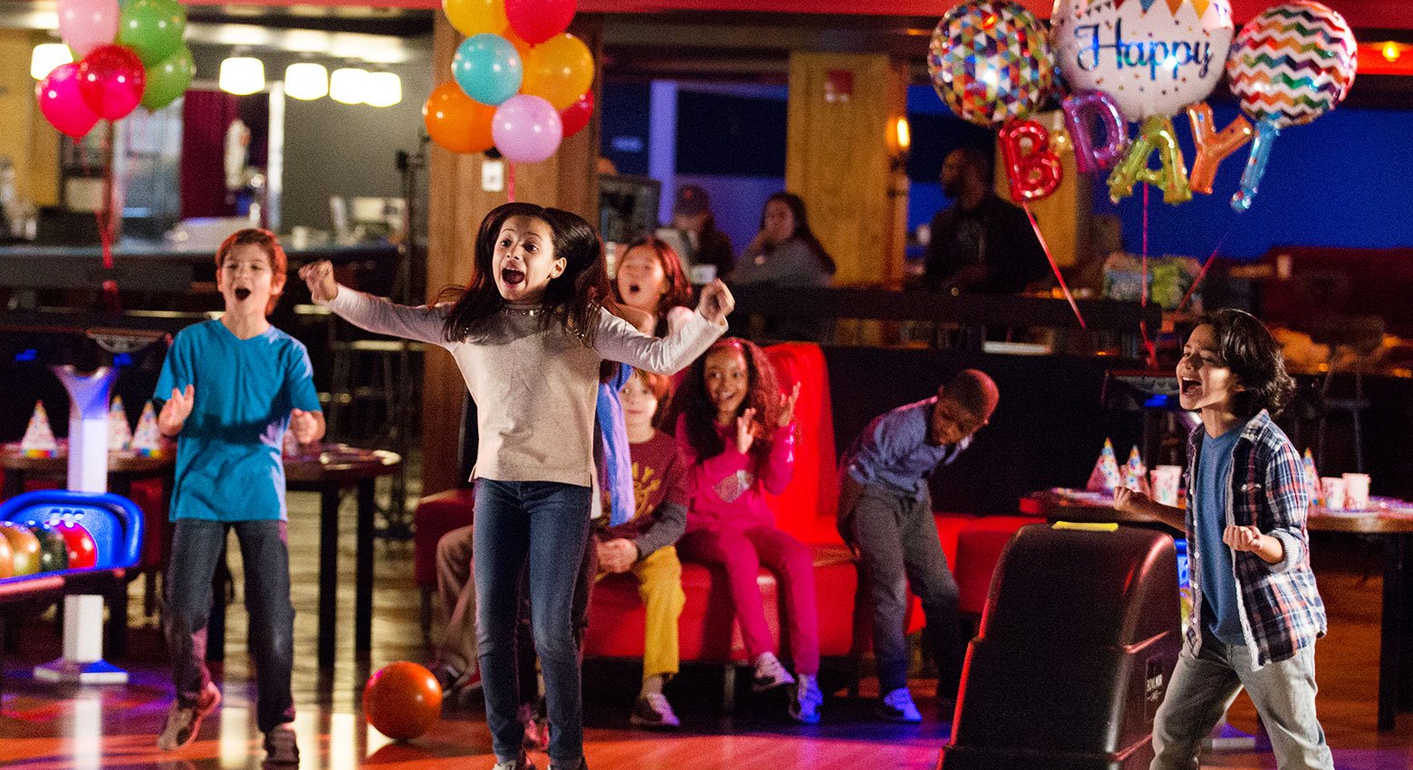 Kids bowling at a birthday party